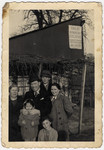 A Jewish family from Tarnow poses in front of the Jan Lacina factory.