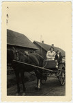 Cesia Honig (right) goes for a ride on a horse and wagon with a woman (possibly her mother).
