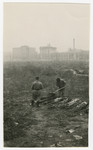 Polish men exhume corpses in a field in Warsaw.

The original caption reads: "The five pictures on this page are very depressing.