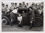 UNRRA director Mordecai Schwartz (pictured in the automobile) assists in the repatriation of Polish displaced persons.