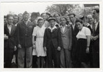 UNRRA director, Mordecai Schwartz poses with residents of the Wildflecken displaced persons' camp.