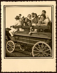 A group of Romanian Jewish youth go for an excursion in a horse-drawn cart.