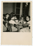 Children eat a meal in the  OSE Taverny children's home.