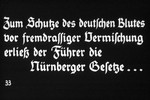 33rd Nazi propaganda slide of a Hitler Youth educational presentation entitled "Germany Overcomes Jewry."

Zum Schutze des deutschen Blutes vor fremdrassiger Vermischung erliess der Fuhrer die.