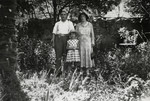 Denise Caraco, her mother Andree and her uncle Emile (her mother's brother) pose in a garden while spending their summer holidays in the village of Dieulefit.