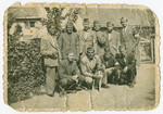 Group portrait of a Jewish forced labor unit.

Lajos Osztreicher is squatting on the left.