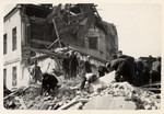 Polish civilians clear the rubble of a bombed out building in besieged Warsaw.