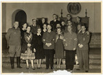 Adolph Hitler poses with other Nazi officals and their wives (?)