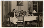 Two German-Jewish couples toast in the New Year.

Seated on the right are Dr.