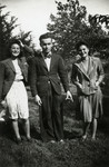 Two Belgian Jewish sisters pose with an unidentified man.