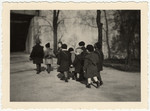 Kindergarten children in Ludwigshafen walk to school holding hands.