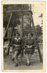Two Jewish teenage girls sit in a park in Berlin.