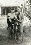 Frania (Freida) and Moshe (Moszek) Finkelstein pose with a bicycle in the  Schlachtensee displaced persons camp.