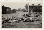 Corpses lie strewn about in the street of the Buchenwald concentration camp following liberation.