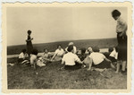 Ruth Rappaport and her friends from the Zionist movement rest in a field in Vyzhnytsa..