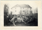 Zionist youth relax in the grass after work at Schloss von Elgg.