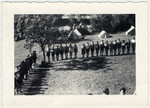 Zionist youth in Switzerland stand for morning roll call at a summer camp.