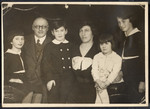 The Schwarzhaupt family sits for a studio portrait in 1935, right before the oldest daughters, Rose and Hanni, immigrate to the United States.