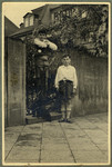 Kurt (top) and Paul Ehrenfeld pose by the entrance gate to their home.
