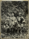 The Ehrenfeld family rests on a bench during an excursion to the woods near their summer home in Falkenstein.