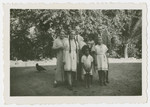 The Tauschers, (Austrian Jewish refugees)  pose with a Trinidadian family.