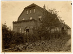 View of the Wertheim home in Brakel, Germany.

Erich, Margarete and Martin Wertheim are standing by the entrance.