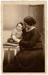 Studio portrait of Margarete Wertheim holding her son Ernst.