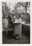 Miriam Rosenthal, holding her son Leslie, poses with the cook at the Barbizon children's home outside of Paris.