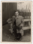 Zus Bielski poses on an outdoor bench before the war.