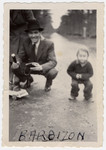 Bela Rosenthal huntches down next to his son Leslie on the grounds of the Barbizon children's home near Paris.