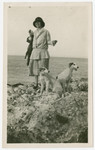 Dora Nacamu Ducly stands on the Ancona shore with her brother Oscar’s dogs.