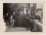 Jewish youth gather around a workshop table in an ORT vocational school in Geneva.