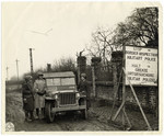 Joseph W. Eaton and Mr. C.W. Kingdon passing the border of Germany on their way to make a reportage on Christmas in Germany in 1944.