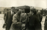 Adolf Hitler greets friends before leaving the airport in Bremen, Germany, 1932.