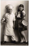 Hans and Ilse Hanauer dress up as a chef and a traditional musician.
