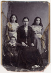 Studio portrait of Berta nee Pollack Engel surrounded by her children Ludwig (age 5), Olga (later Breuer) and Manci.