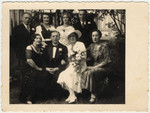 Wedding portrait of a Latvian Jewish family.

Seated from left to right are: Erna Taub Schwab (wife of Leo Schwab), Gustav Smitkowski, the bride Raja Taub Smitkowitzi, and another Taubchen Taub .
