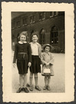 Three Jewish children at a German train station.

Pictured are Ellen Seligman, her best friend Edith Schuld, and Ellen's sister Margit.