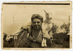 Close-up portrait of Musia Adler, the donor's sister holding a kid goat.