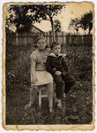 Portrait of two Jewish siblings in the front garden of their house in Bolechow.