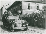 Hitler salutes welcoming crowd in Austria.