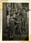 A group of school girls poses outside a building in the Feldafing displaced persons' camp.