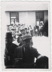 A group of Jewish men line up to receive rations at the Rivesaltes internment camp in France.