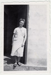 A woman poses in the doorway of a barrack in the Rivesaltes internment camp.