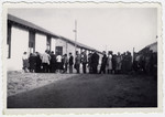 A line of prisoners wait to be served their rations at the Rivesaltes internment camp.