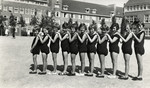 Girls in the Montisorri School in Scheveningen stand in a line in their gym clothes.