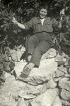 Tina Hajon sits on some large rocks while serving as a partisan.