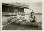 Two young men go boating on the Starnberger Sea near the Feldafing displaced persons camp.