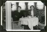 Olga Abraham and Hannie Reinsch sit at a table in either Cuba or the States after emigrating from Germany.