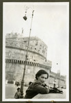 Helga Reinsch leans over a wall while on vacation in Rome.